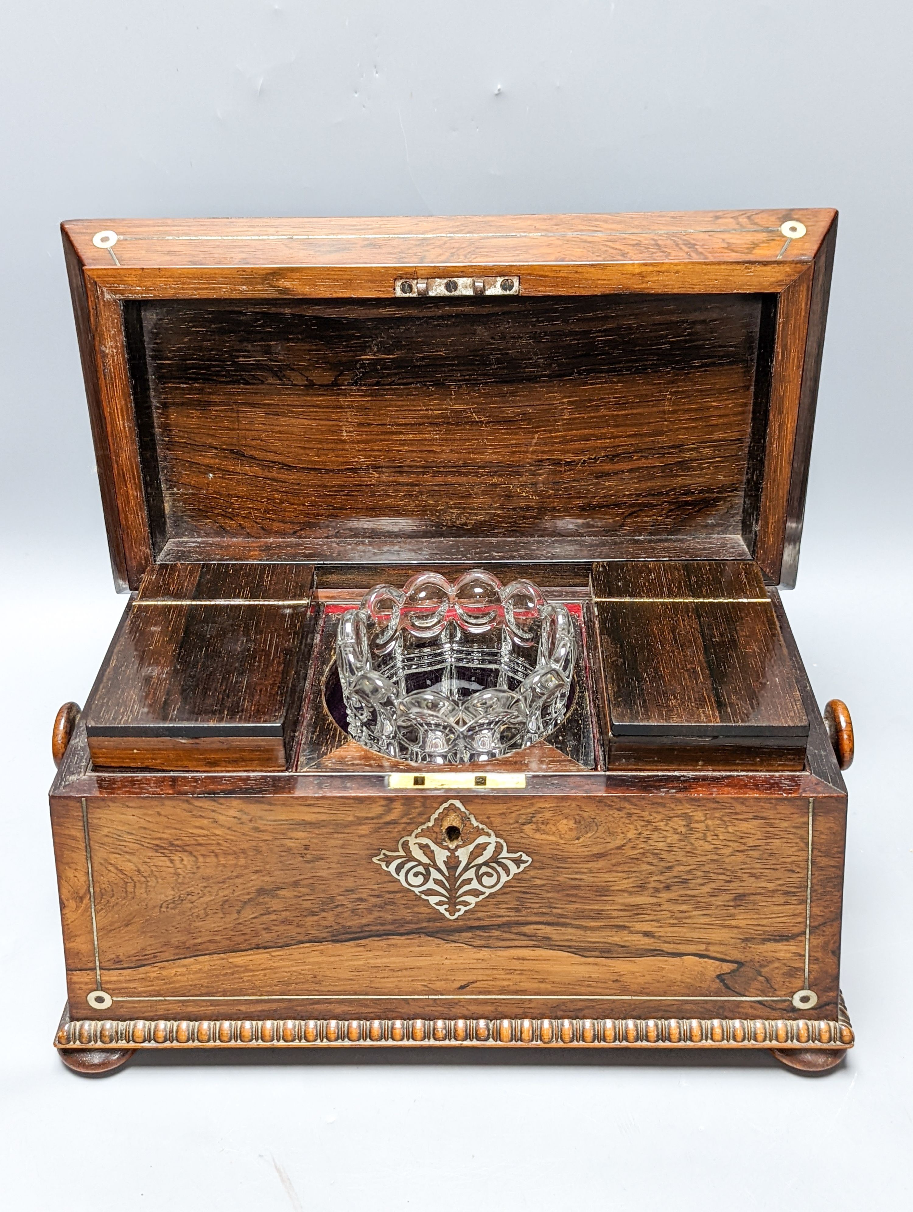 A William IV rosewood tea caddy with mother of Pearl inlay 33cm
